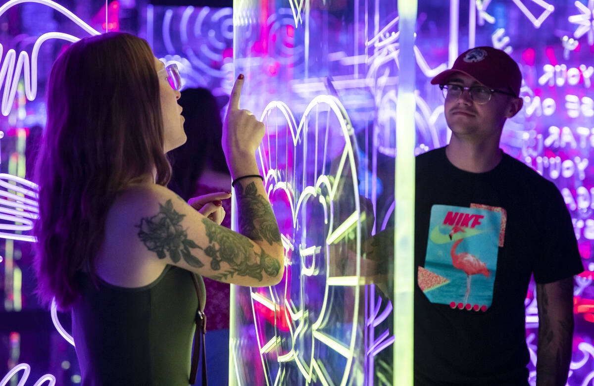 Janessa Ems traces a heart in the air for Dominik Roeglin during a tour through the labyrinth r ...