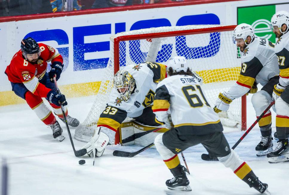 Golden Knights goaltender Adin Hill (33) deflects a shot attempt by Florida Panthers center Col ...