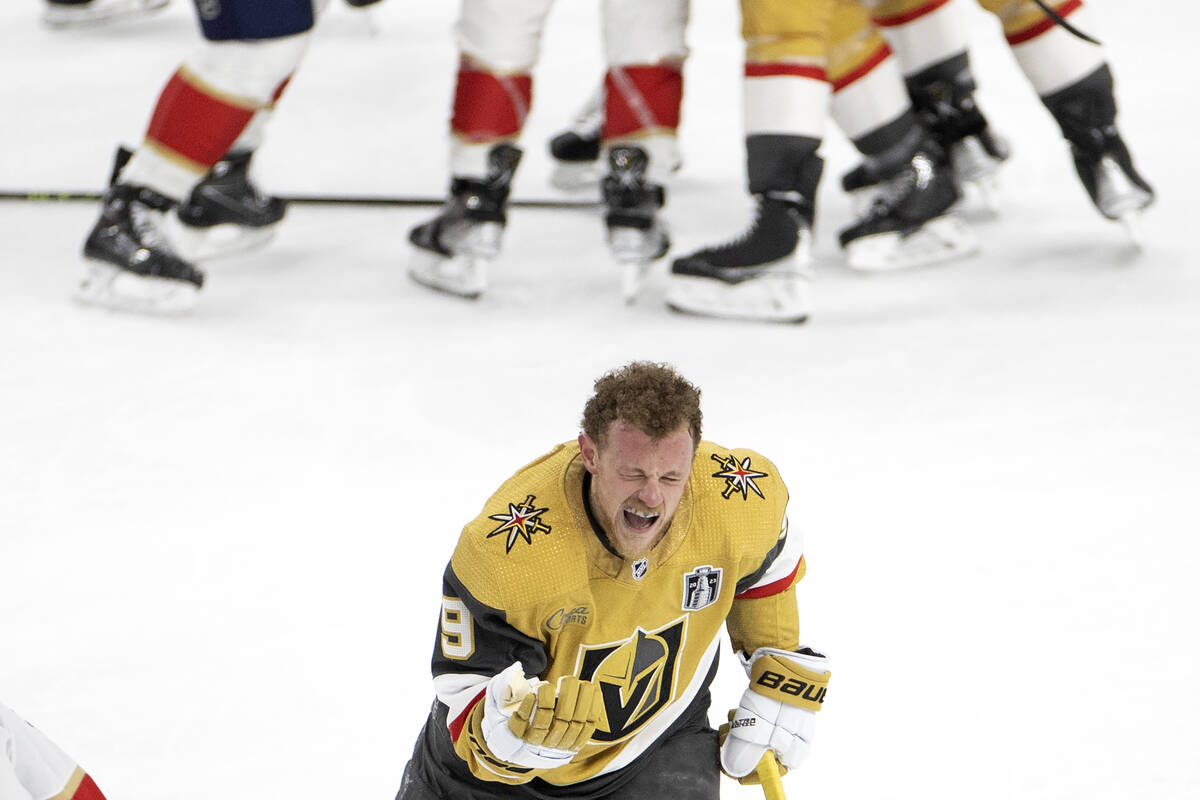 Golden Knights center Jack Eichel (9) skates off the ice from a scrum while grimacing during th ...