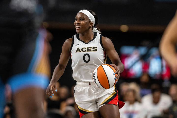 Las Vegas Aces guard Jackie Young (0) moves the ball during a WNBA basketball game against the ...