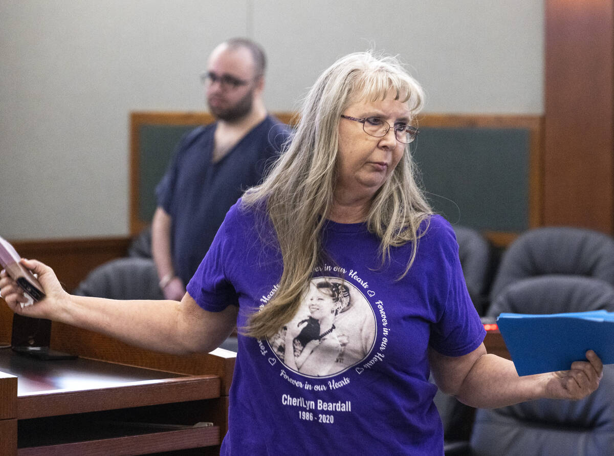 Susanne Beardall, the mother of murder victims Cheryl Beardall, wearing a shirt displaying her ...