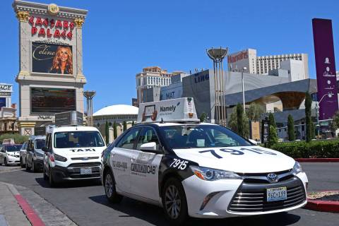 Cab drivers pull into the taxi pick up lane at Caesars Palace in Las Vegas in 2017. (Las Vegas ...