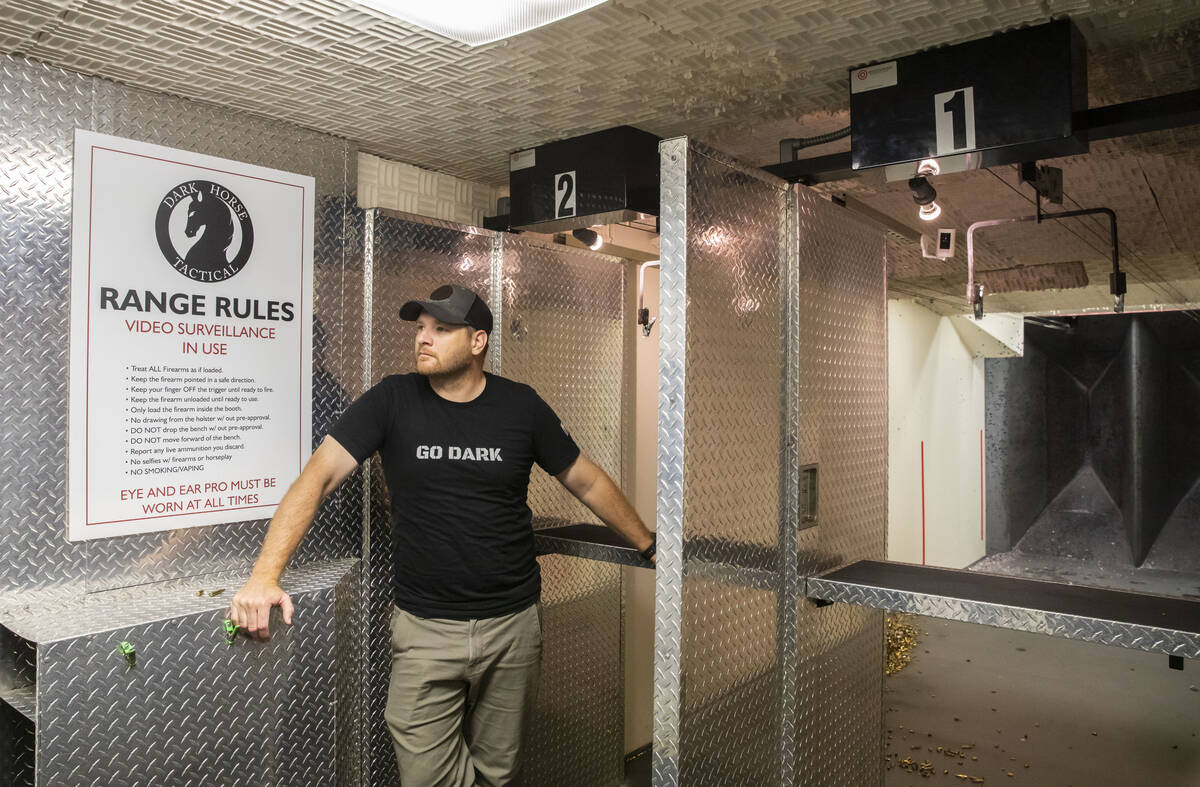 Josh Nilson, owner of Dark Horse Tactical, stands in front of the shooting range at his store a ...
