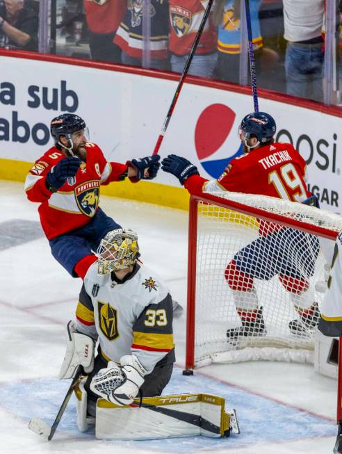 Golden Knights goaltender Adin Hill (33) looks away as Florida Panthers defenseman Aaron Ekblad ...