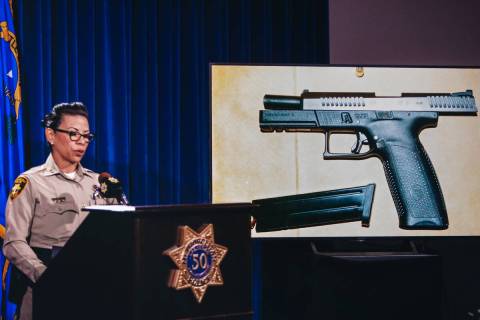 Assistant Sheriff Yasina Yatomi shows the gun that Matthew Glunt allegedly used to shoot at two ...
