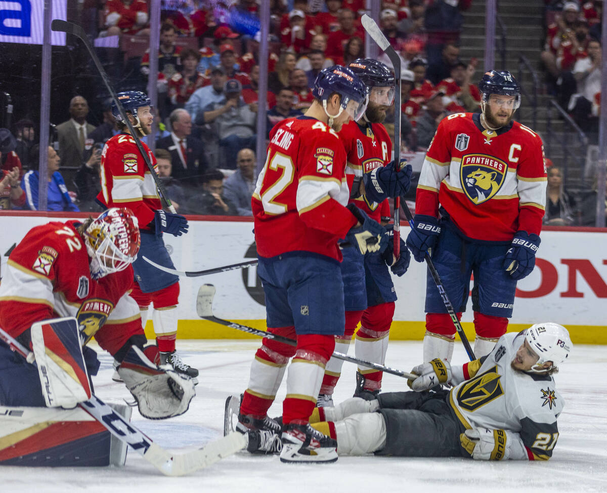 Golden Knights center Brett Howden (21) lays on the ice after being knocked down by Florida Pan ...