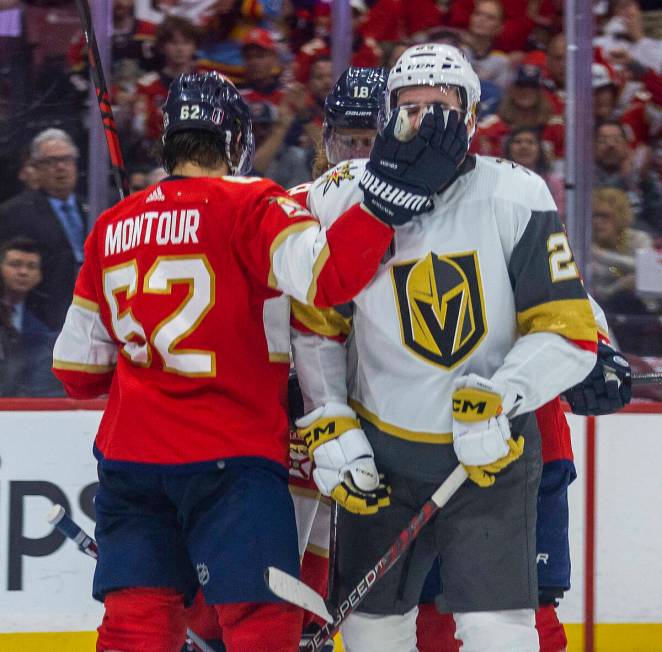 Florida Panthers defenseman Brandon Montour (62) smacks the face of Golden Knights defenseman Z ...