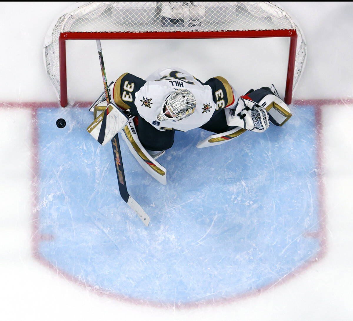 Golden Knights goaltender Adin Hill (33) deflects a shot upwards from the Florida Panthers in t ...
