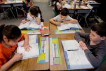 Student's in Amy Bennett's third grade classroom work on mathematics at Vanderburg Elementary i ...