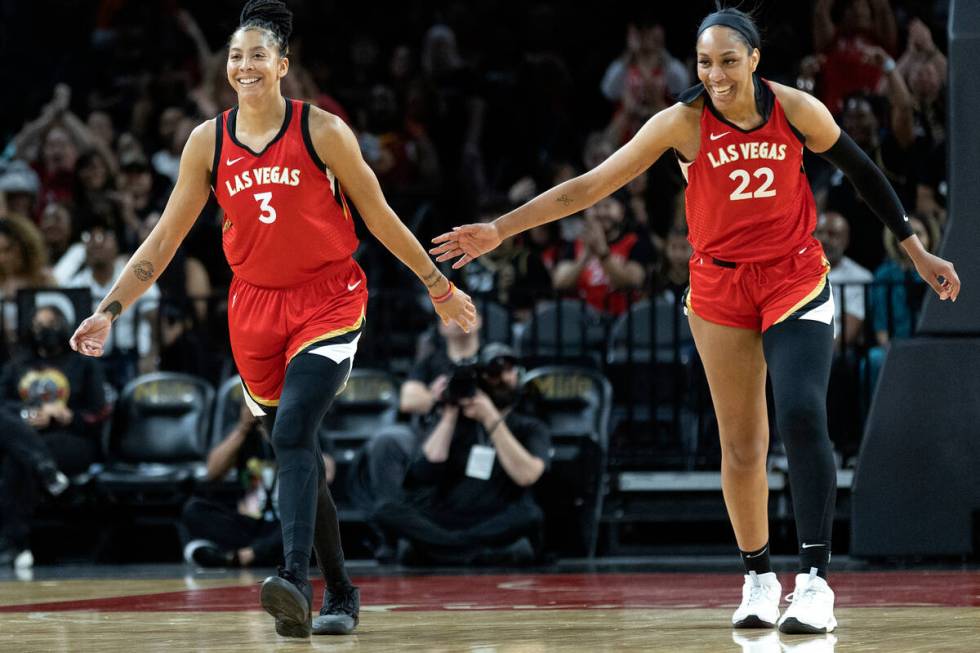 Aces forward Candace Parker (3) and Aces forward A'ja Wilson (22) slap hands after Parker score ...