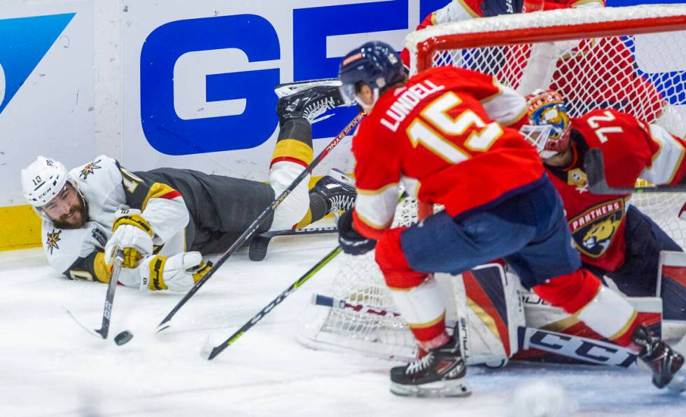 Golden Knights center Nicolas Roy (10) still attempts to pass from the ice past Florida Panther ...