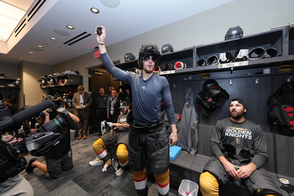 Brett Howden wears an Elvis wig and sunglasses after the Golden Knights' Game 2 win over the Fl ...