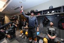 Brett Howden wears an Elvis wig and sunglasses after the Golden Knights' Game 2 win over the Fl ...