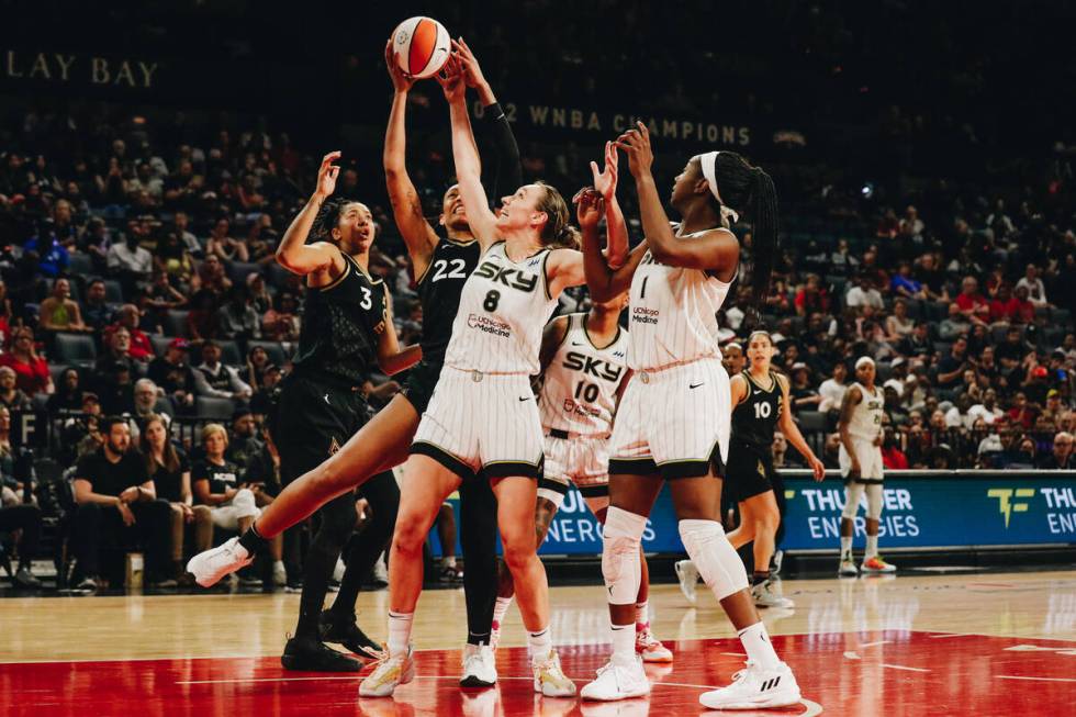 Aces center A’ja Wilson (22) goes up for a basket as Chicago Sky forward Alanna Smith (8 ...