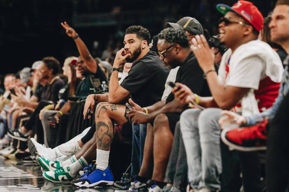 Celtics small forward Jayson Tatum watches the Las Vegas Aces play against the Chicago Sky in a ...