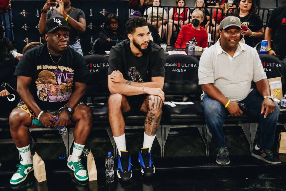 Celtics small forward Jayson Tatum sits courtside as the Las Vegas Aces take on the Chicago Sky ...