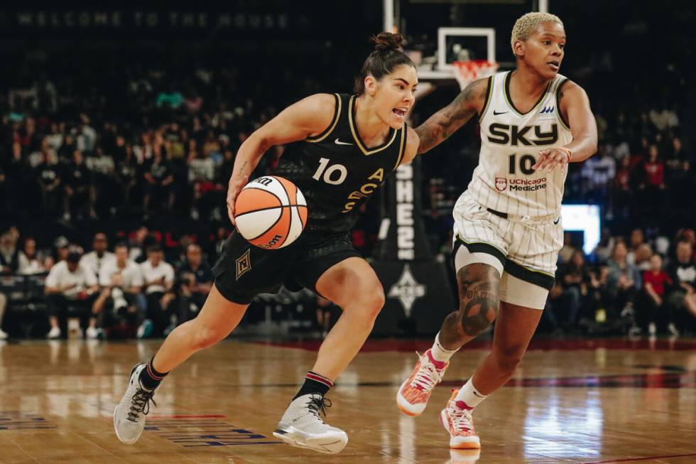 Aces Kelsey Plum (left) drives the ball towards the hoop as Chicago Sky guard Courtney Williams ...