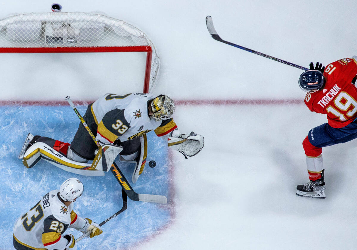 Golden Knights goaltender Adin Hill (33) rejects a shot by Florida Panthers left wing Matthew T ...