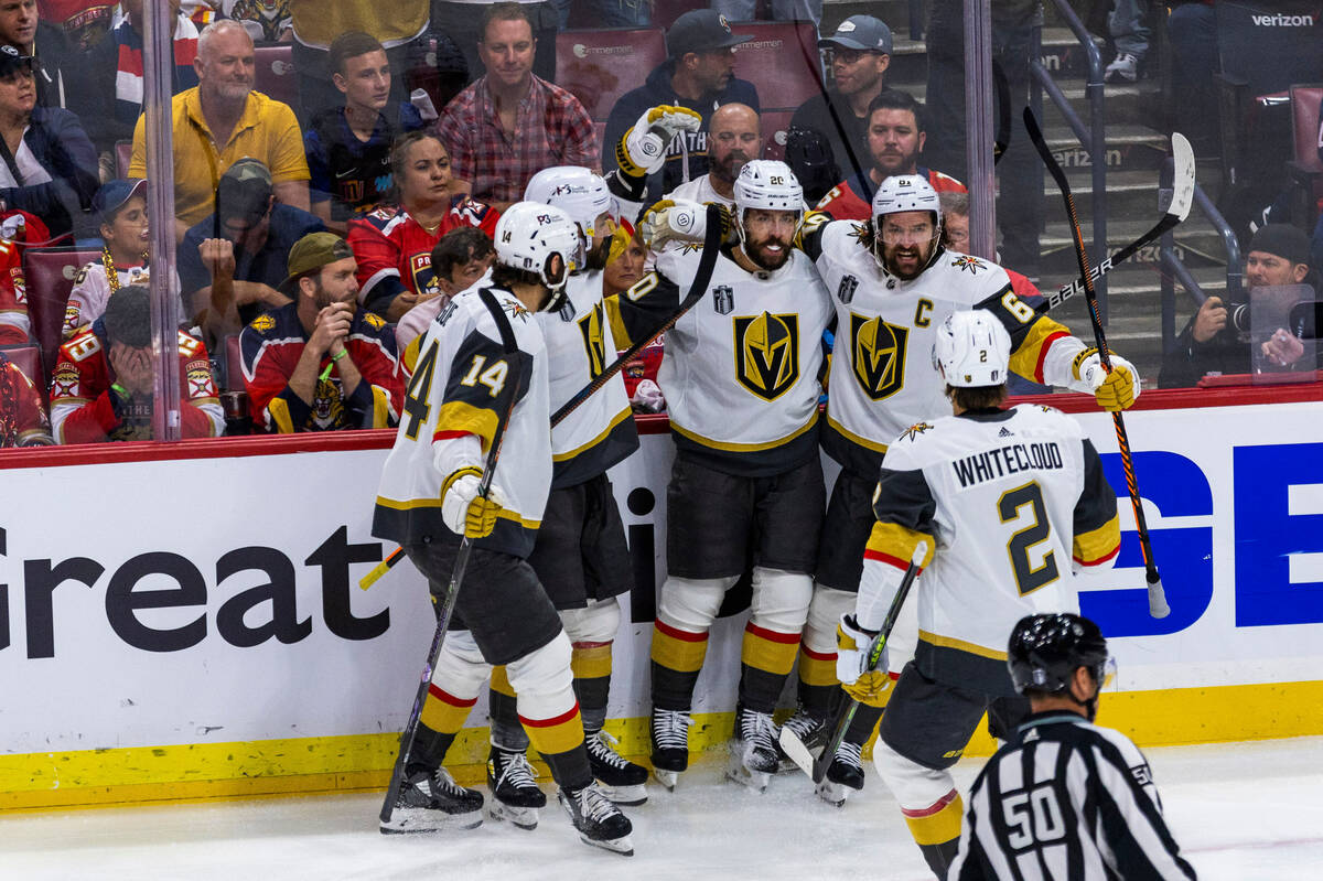 Golden Knights center Chandler Stephenson (20) with teammates celebrate his first goal in perio ...