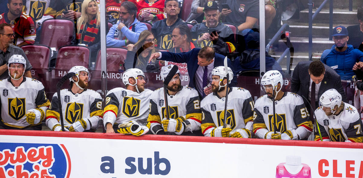 Golden Knights head coach Bruce Cassidy confers with his players on the bench against the Flori ...
