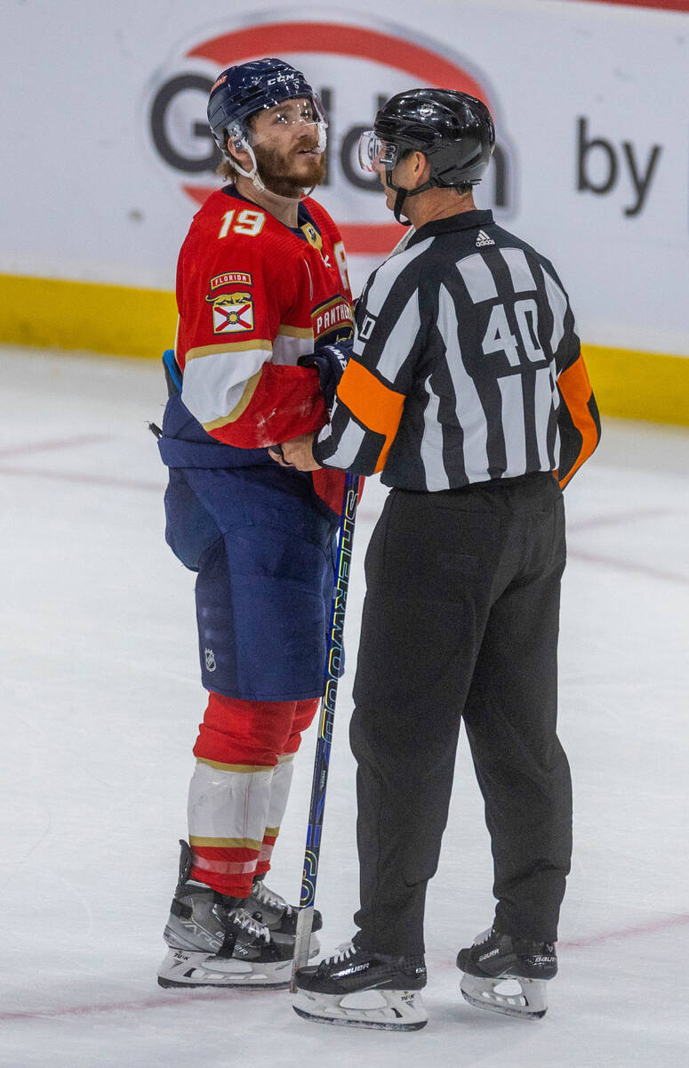 Florida Panthers left wing Matthew Tkachuk (19) is counseled after a fight with the Golden Knig ...