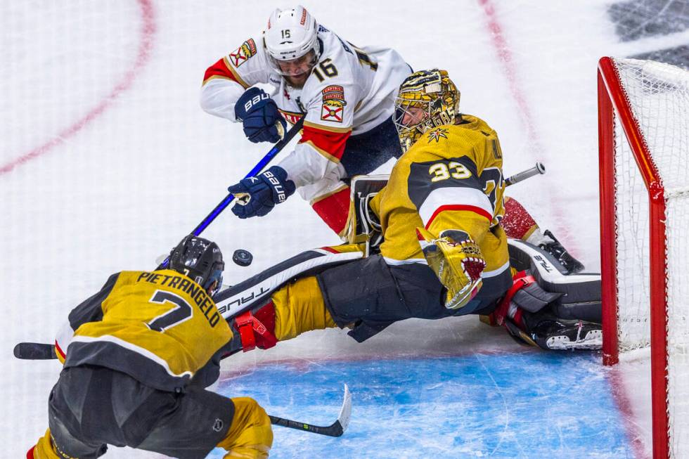 Golden Knights goaltender Adin Hill (33) saves a goal attempt by Florida Panthers center Aleksa ...