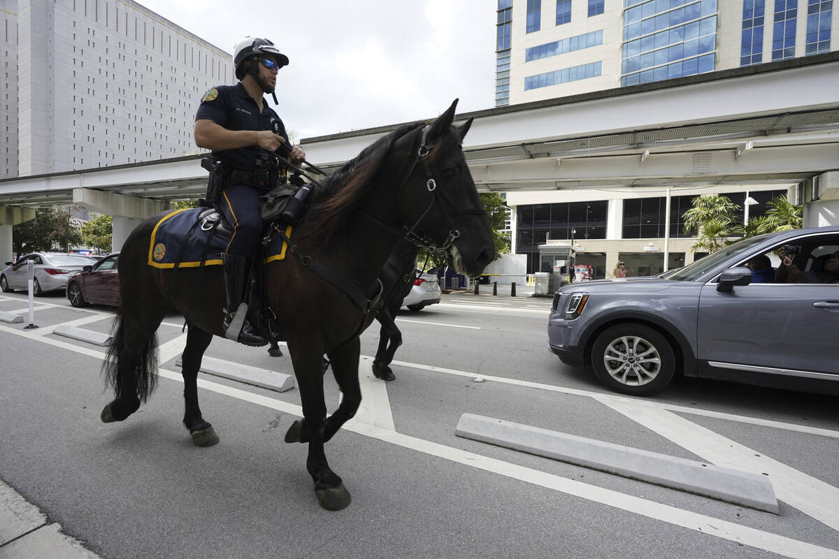 Mounted police ride around the Wilkie D. Ferguson Jr. U.S. Courthouse on Tuesday, June 13, 2023 ...