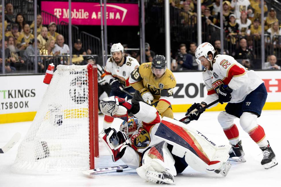 The puck gets under Florida Panthers goaltender Sergei Bobrovsky (72) for a Golden Knights goal ...