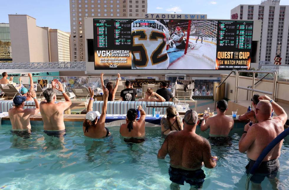 Golden Knights fans cheer their team’s second goal during Game 5 of the Stanley Cup Fina ...