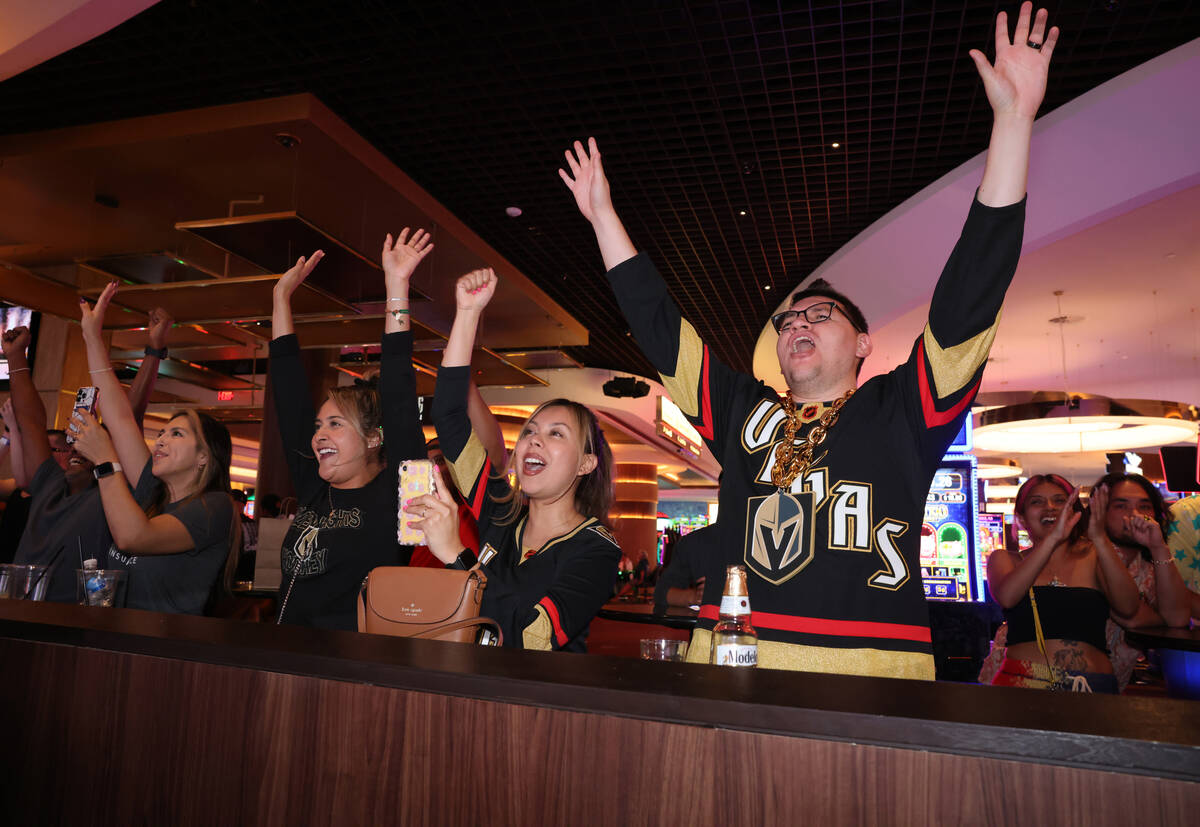 Golden Knights fans cheer as their team is presented the Stanley Cup while watching from Circa ...