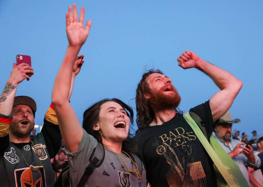 Fans celebrate the Golden Knights winning the Stanley Cup at the Water Street Plaza watch party ...