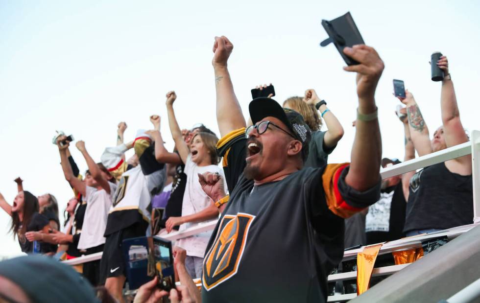 Fans celebrate the Golden Knights winning the Stanley Cup at the Water Street Plaza watch party ...