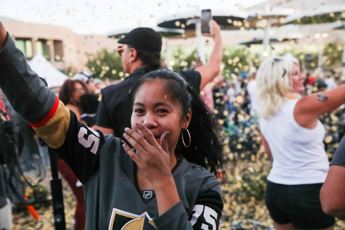 Fans celebrate the Golden Knights winning the Stanley Cup at the Water Street Plaza watch party ...