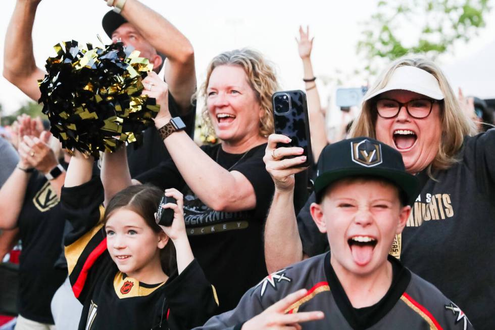 Fans celebrate the Golden Knights winning the Stanley Cup at the Water Street Plaza watch party ...