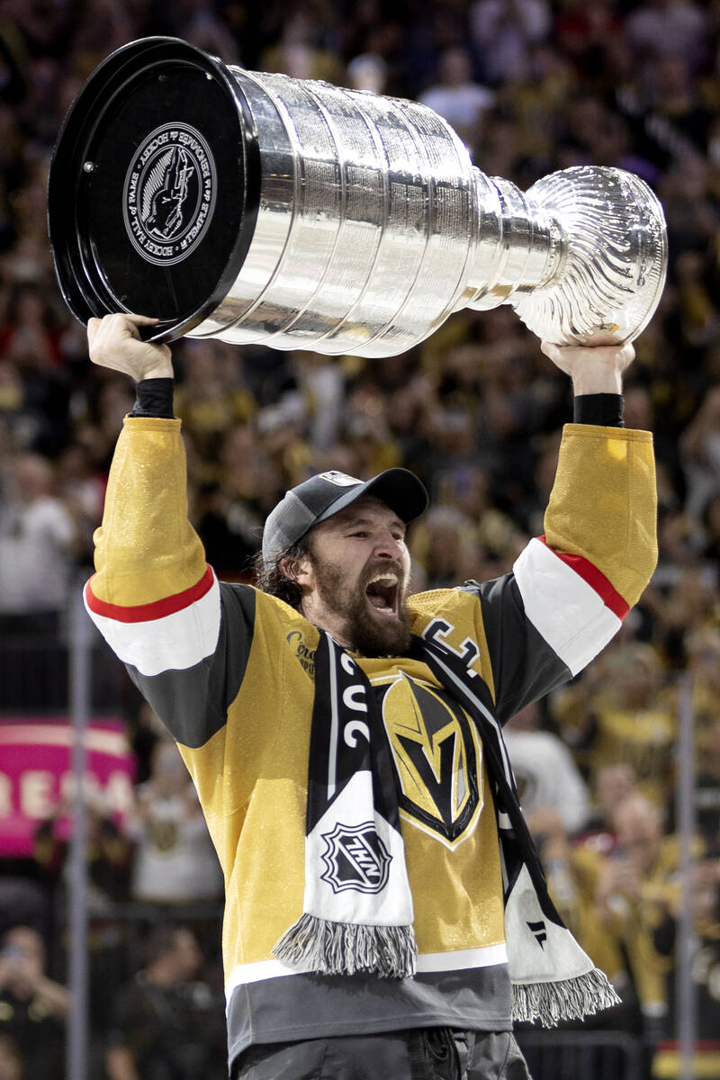 Golden Knights right wing and captain Mark Stone holds up the Stanley Cup after winning Game 5 ...