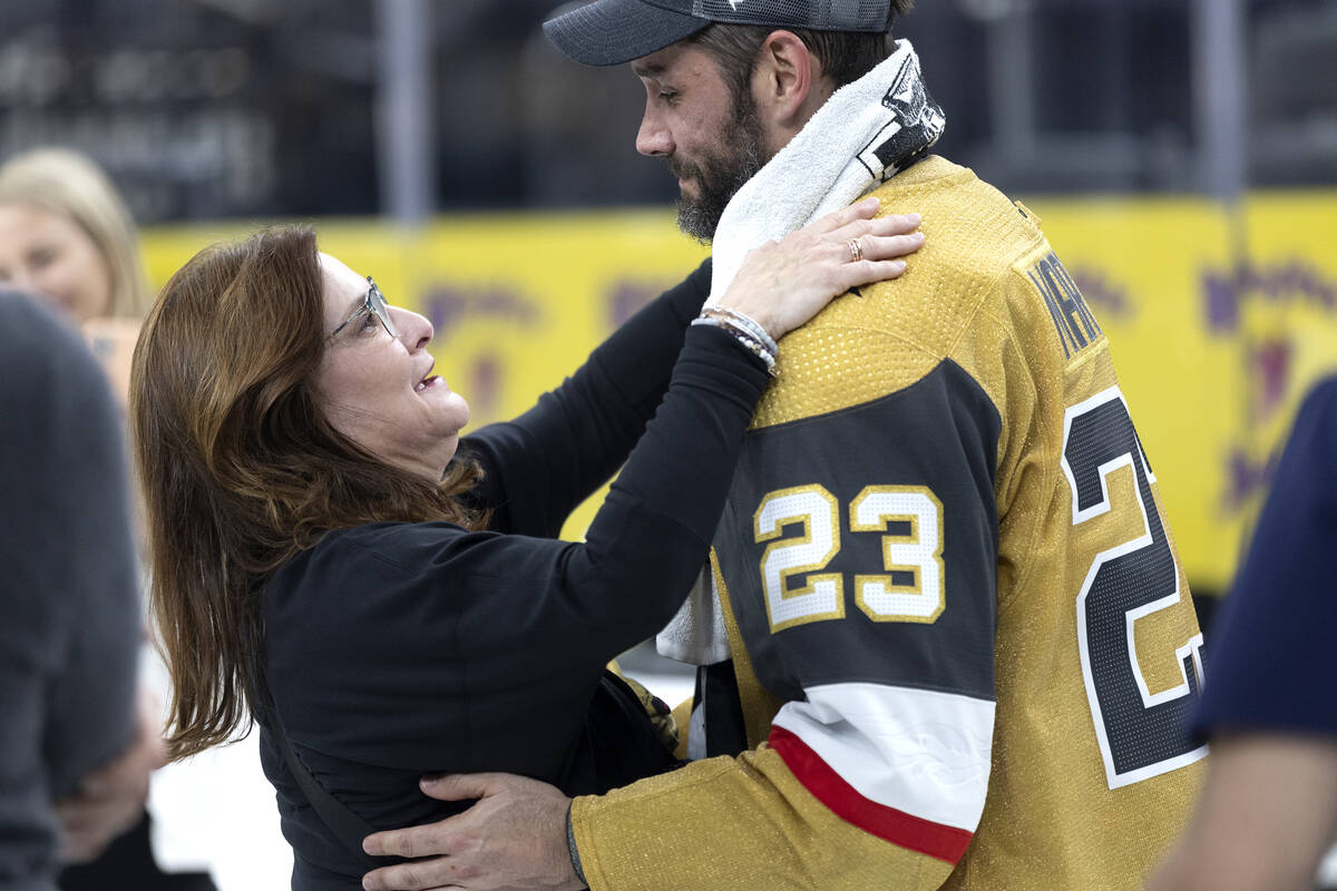 Golden Knights defenseman Alec Martinez (23) hugs his mother, Lynette Martinez, after winning t ...