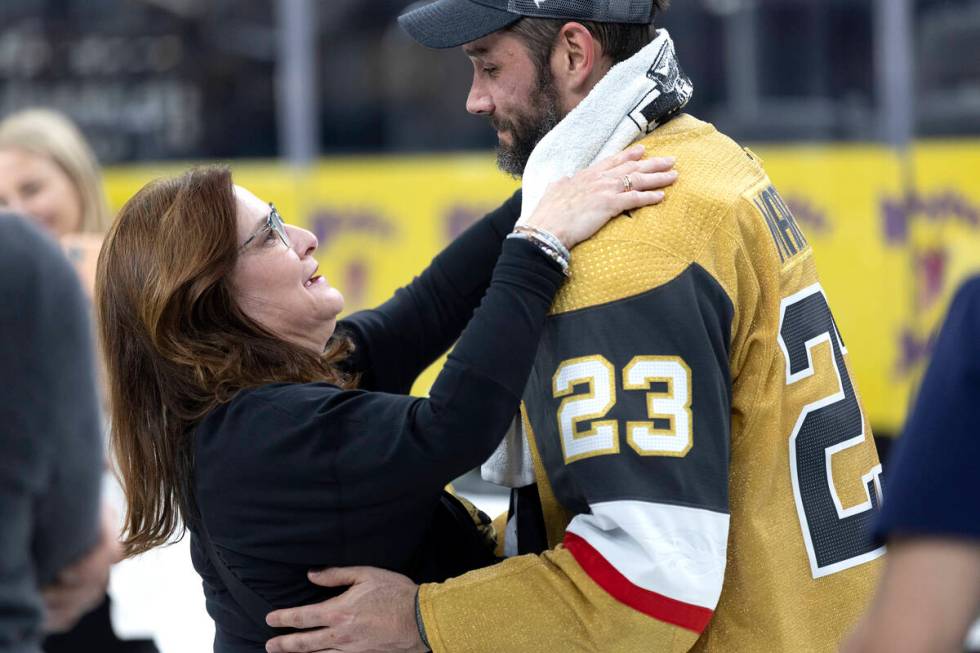 Golden Knights defenseman Alec Martinez (23) hugs his mother, Lynette Martinez, after winning t ...