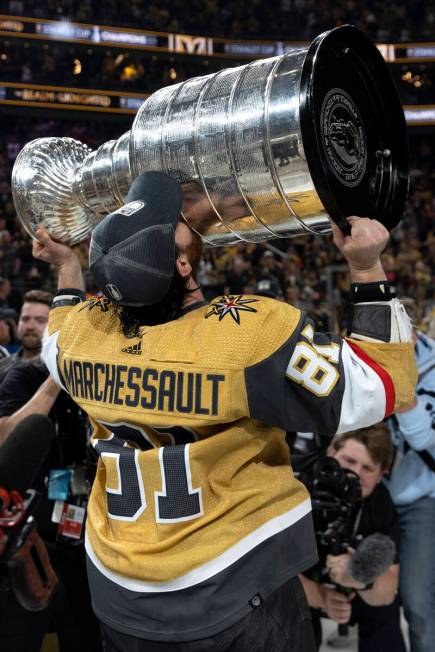 Golden Knights right wing Jonathan Marchessault (81) kisses the Stanley Cup after his team defe ...