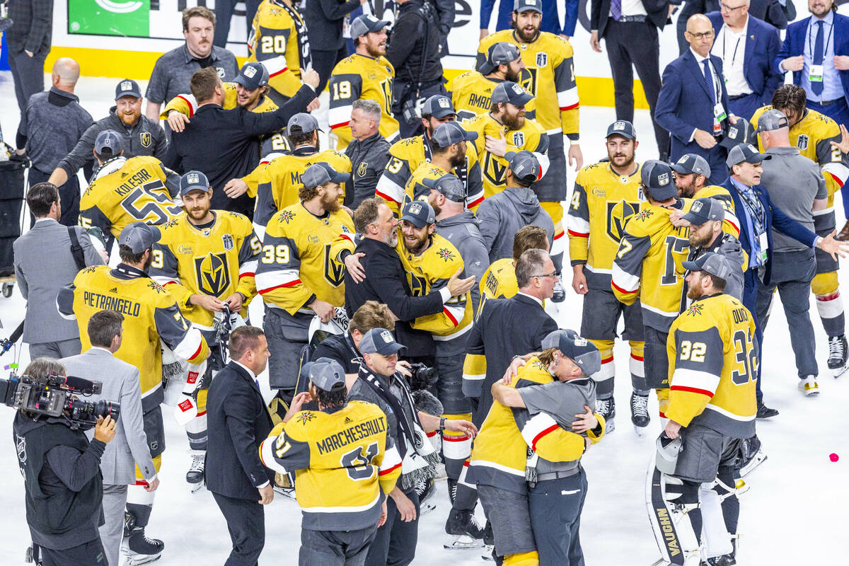 Golden Knights players, coaches and staff celebrate after their 9-3 win over the Florida Panthe ...