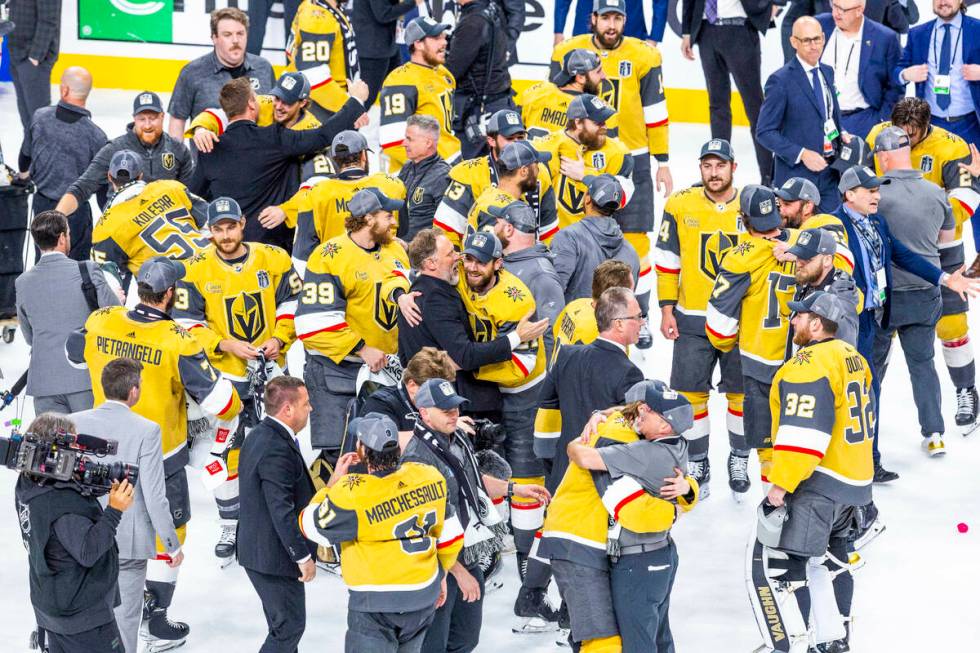 Golden Knights players, coaches and staff celebrate after their 9-3 win over the Florida Panthe ...