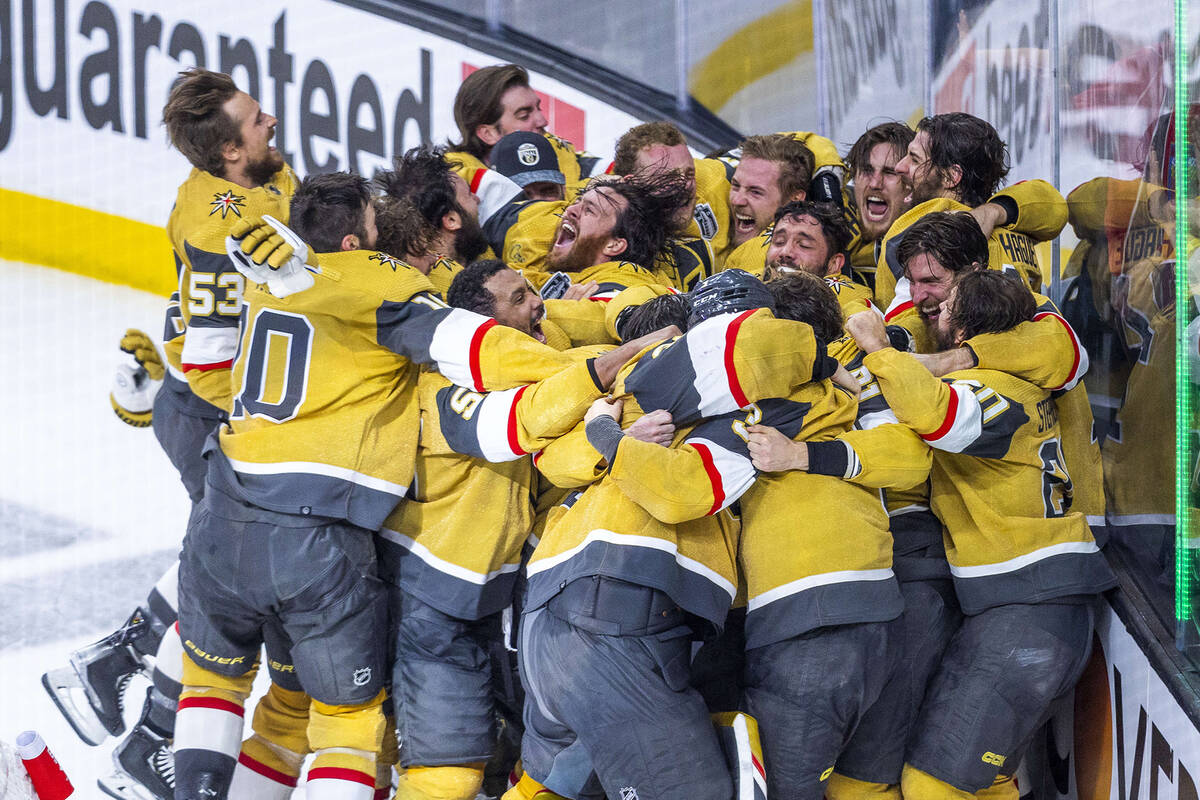 The Golden Knights players celebrate their 9-3 win over the Florida Panthers following Game 5 w ...