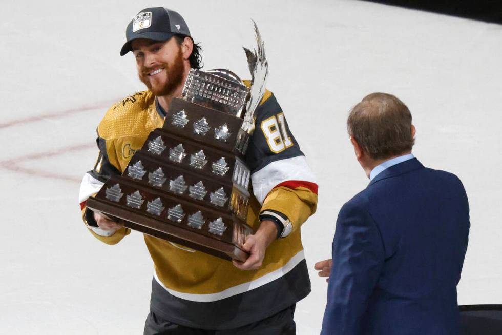 Vegas Golden Knights right wing Jonathan Marchessault hold the Conn Smythe Trophy after the Kni ...