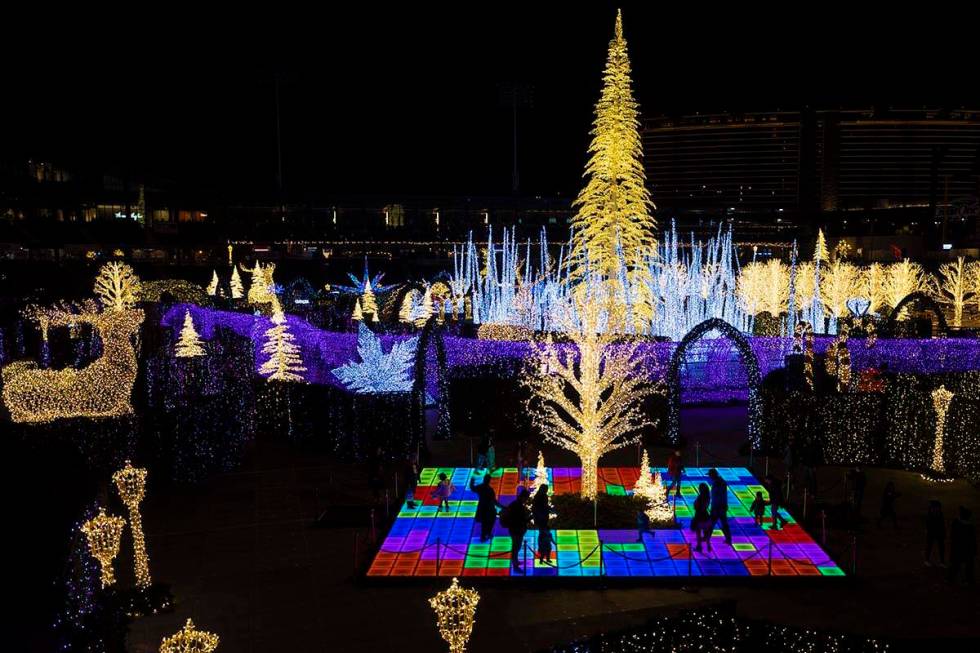 Attendees explore Enchant Christmas at Las Vegas Ballpark on Tuesday, Nov. 30, 2021, in Las Veg ...