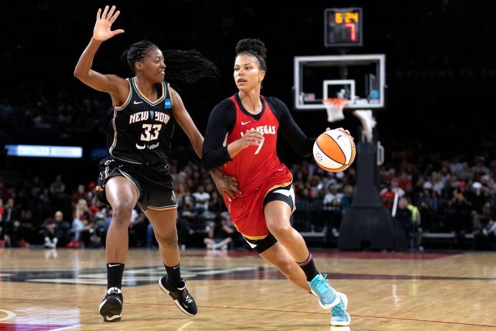 Aces forward Alysha Clark (7) drives around New York Liberty’s Stephanie Mawuli (33) dur ...