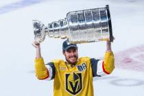 Golden Knights right wing Reilly Smith (19) hoists the Stanley Cup after defeating the Florida ...