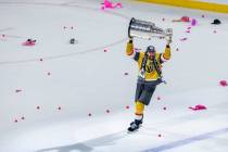 Golden Knights right wing Mark Stone (61) hoists the Stanley Cup after defeating the Florida Pa ...