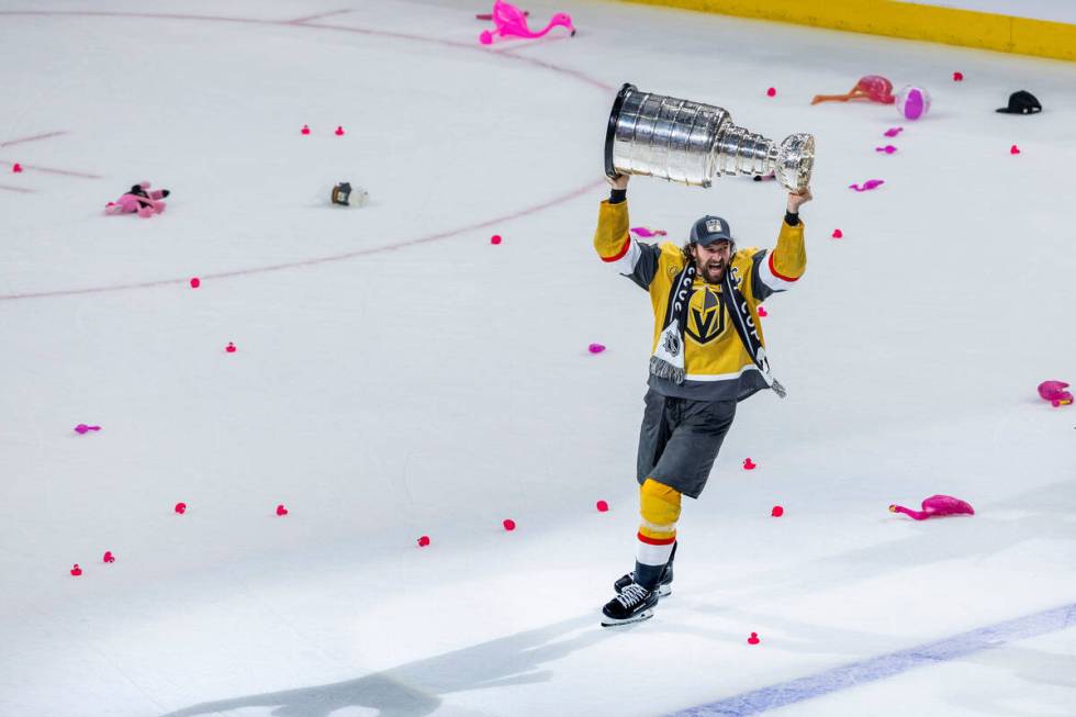 Golden Knights right wing Mark Stone (61) hoists the Stanley Cup after defeating the Florida Pa ...