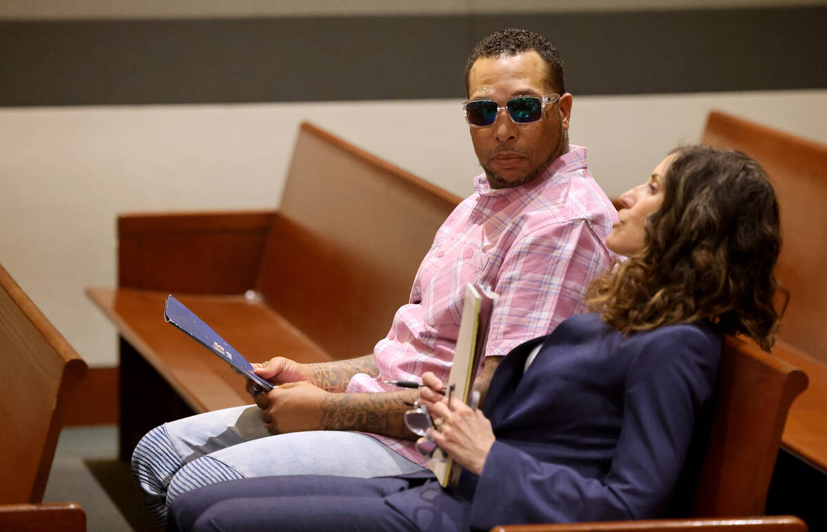 Jason Wiggins talks to his attorney Maria Cleveland in court before a preliminary hearing at th ...