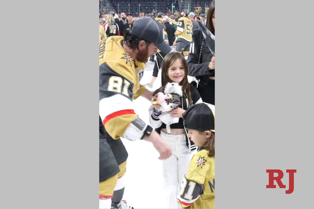 Golden Knights forward Jonathan Marchessault prepares to take a photo of the Stanley Cup with h ...