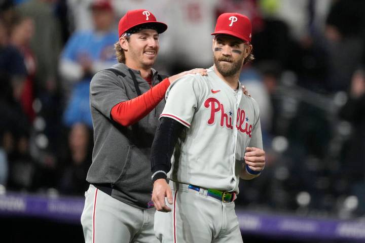 Philadelphia Phillies' Bryson Stott, left, congratulates Bryce Harper after a baseball game aga ...